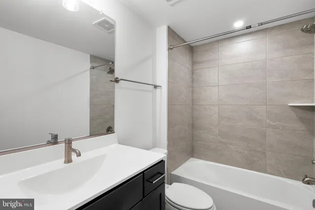 a bathroom with a shower and a sink