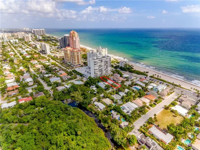 a view of a house with backyard sitting area and garden