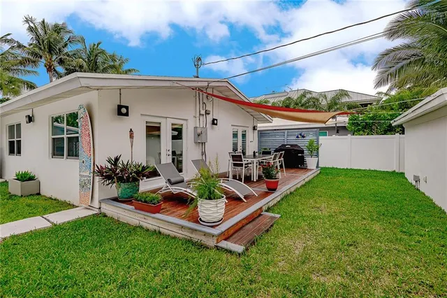 a front view of a house with a garden and parking space