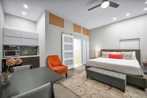 a workspace with furniture and wooden floor