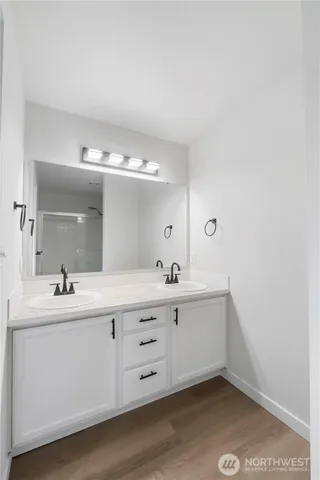 a bathroom with a sink and a mirror