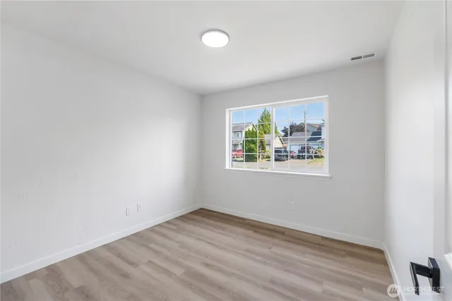 an empty room with windows and window