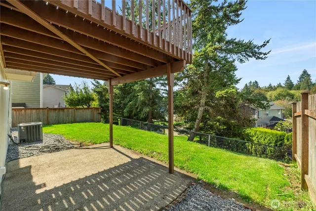 a view of yard with patio