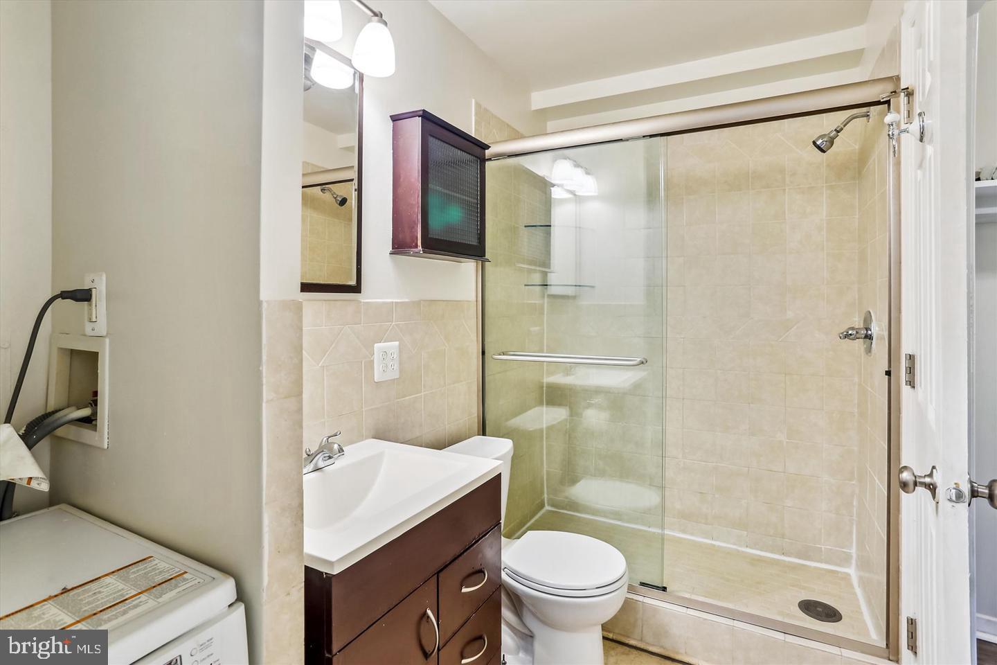 1900 Lyttonsville Road, Unit 602 Silver Spring, MD 20910 - Photo 14 of 43 a bathroom with a sink toilet and shower