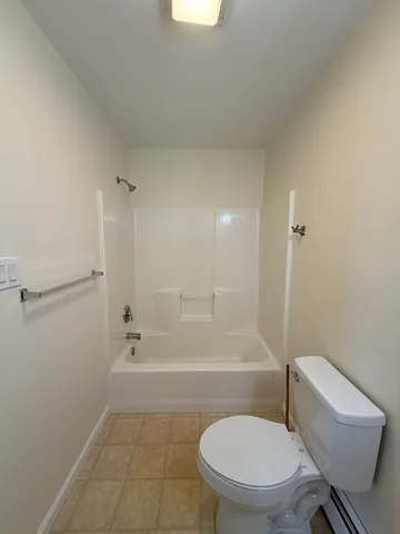 a bathroom with a toilet a sink and bathtub