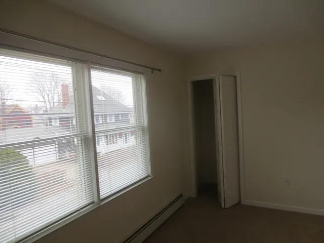 a view of a room that has a window in it