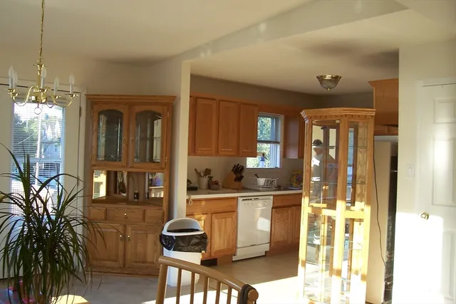 a kitchen with a refrigerator and a stove