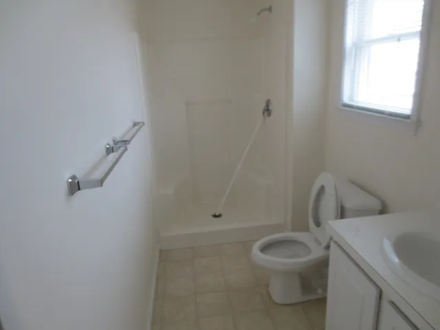 a bathroom with a toilet sink and tub