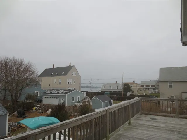 a view of a balcony with wooden floor
