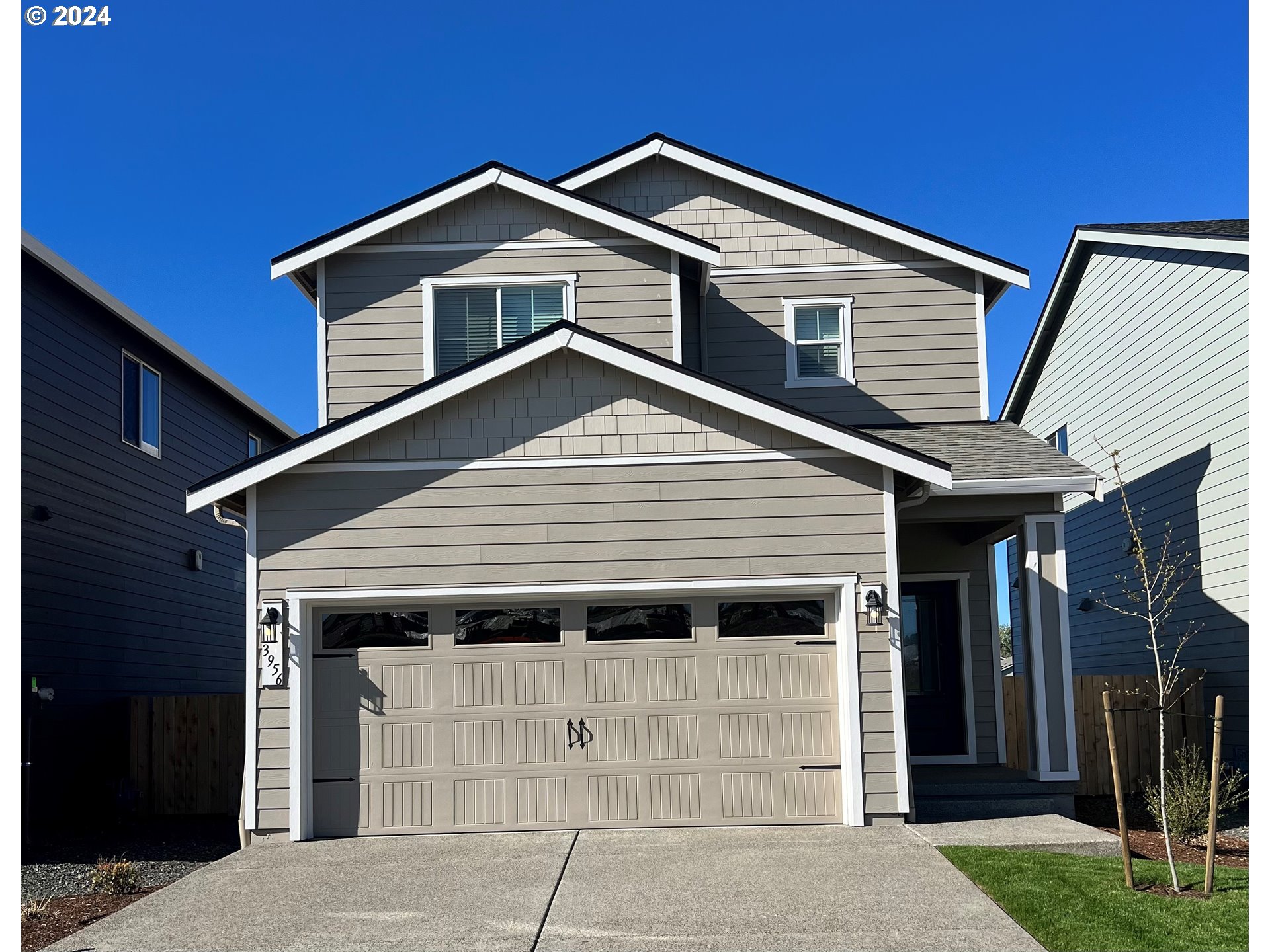 3956 Southwest Knapp Drive Gresham, OR 97080 - Photo 1 of 14 a front view of a house with a yard