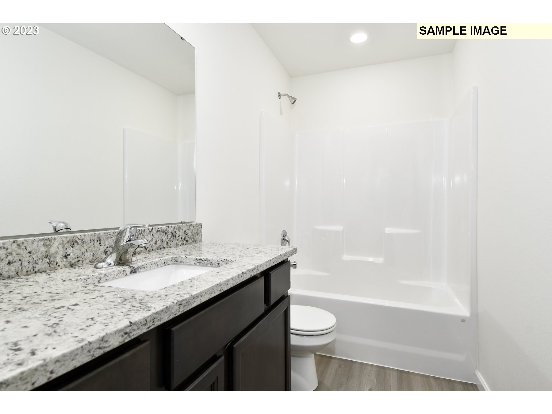 3956 Southwest Knapp Drive Gresham, OR 97080 - Photo 14 of 14 a bathroom with a granite countertop sink a toilet and shower