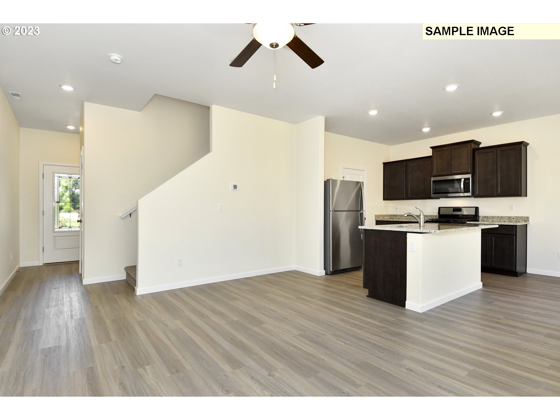 3956 Southwest Knapp Drive Gresham, OR 97080 - Photo 4 of 14 a view of kitchen with stainless steel appliances refrigerator stove microwave and cabinets