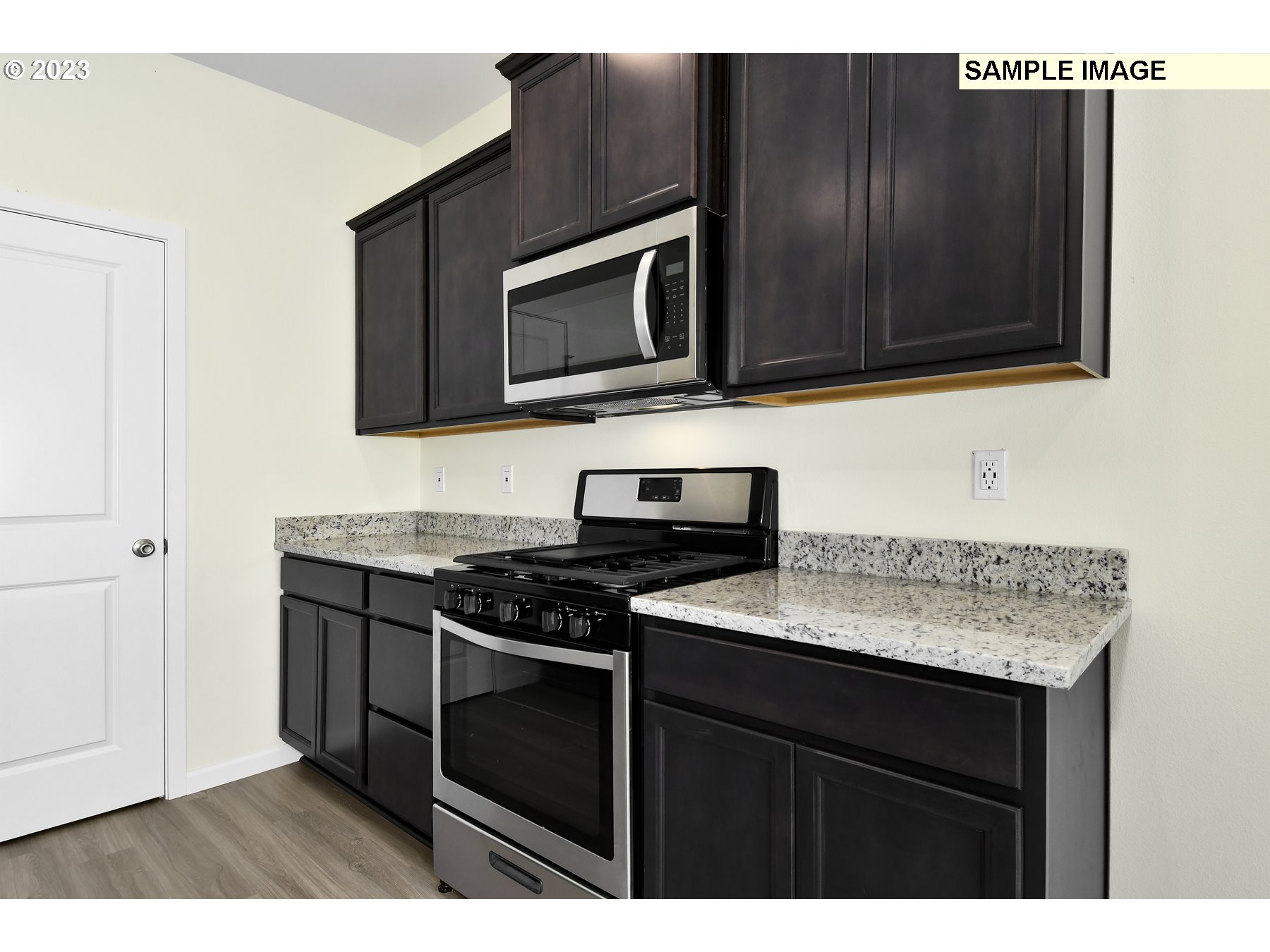 3956 Southwest Knapp Drive Gresham, OR 97080 - Photo 6 of 14 a kitchen with a sink stove and microwave
