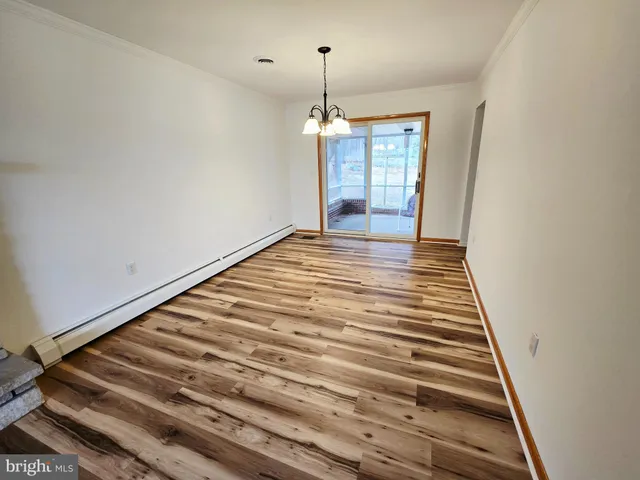 a kitchen with stainless steel appliances a stove a sink and a refrigerator