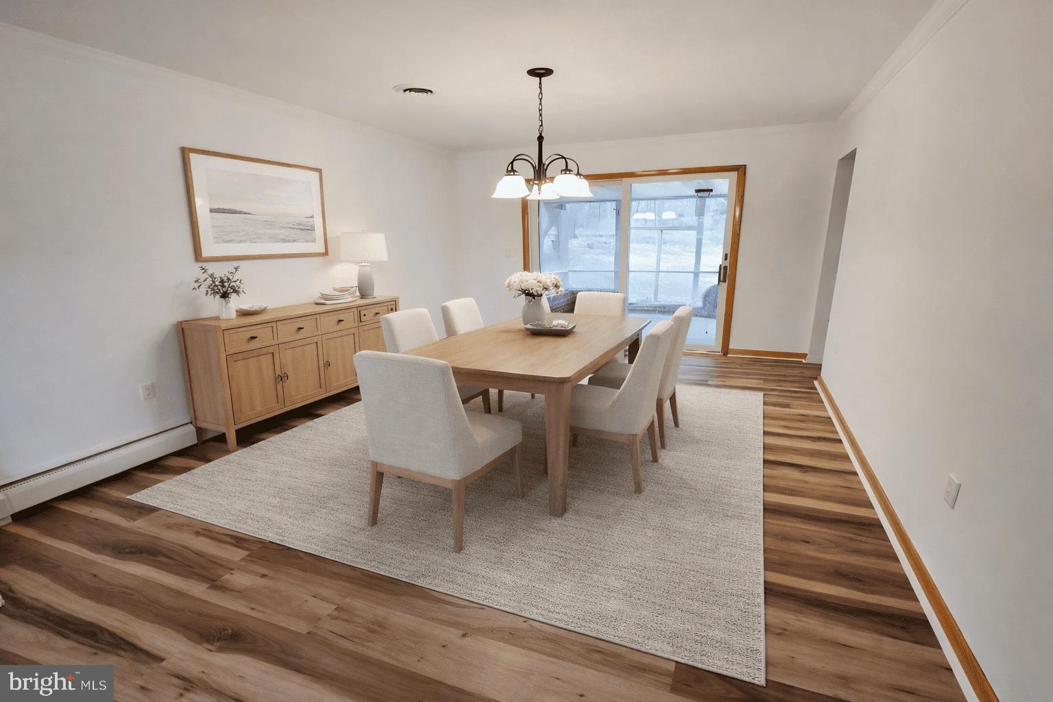 15421 Shamrock Road Southwest Cumberland, MD 21502 - Photo 13 of 39 a dining room with furniture a chandelier and wooden floor