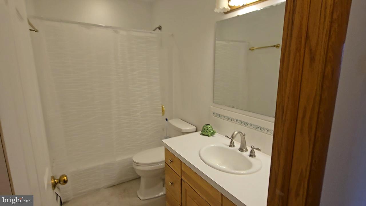 15421 Shamrock Road Southwest Cumberland, MD 21502 - Photo 20 of 39 a bathroom with a sink a toilet and a mirror