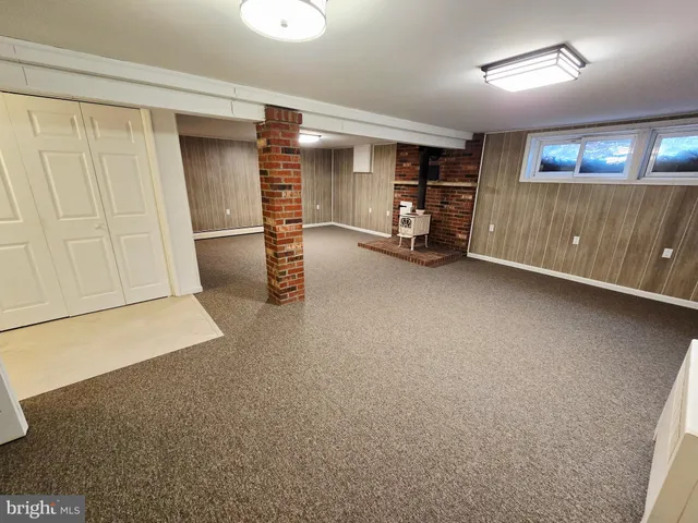 a view of an empty room with a fireplace