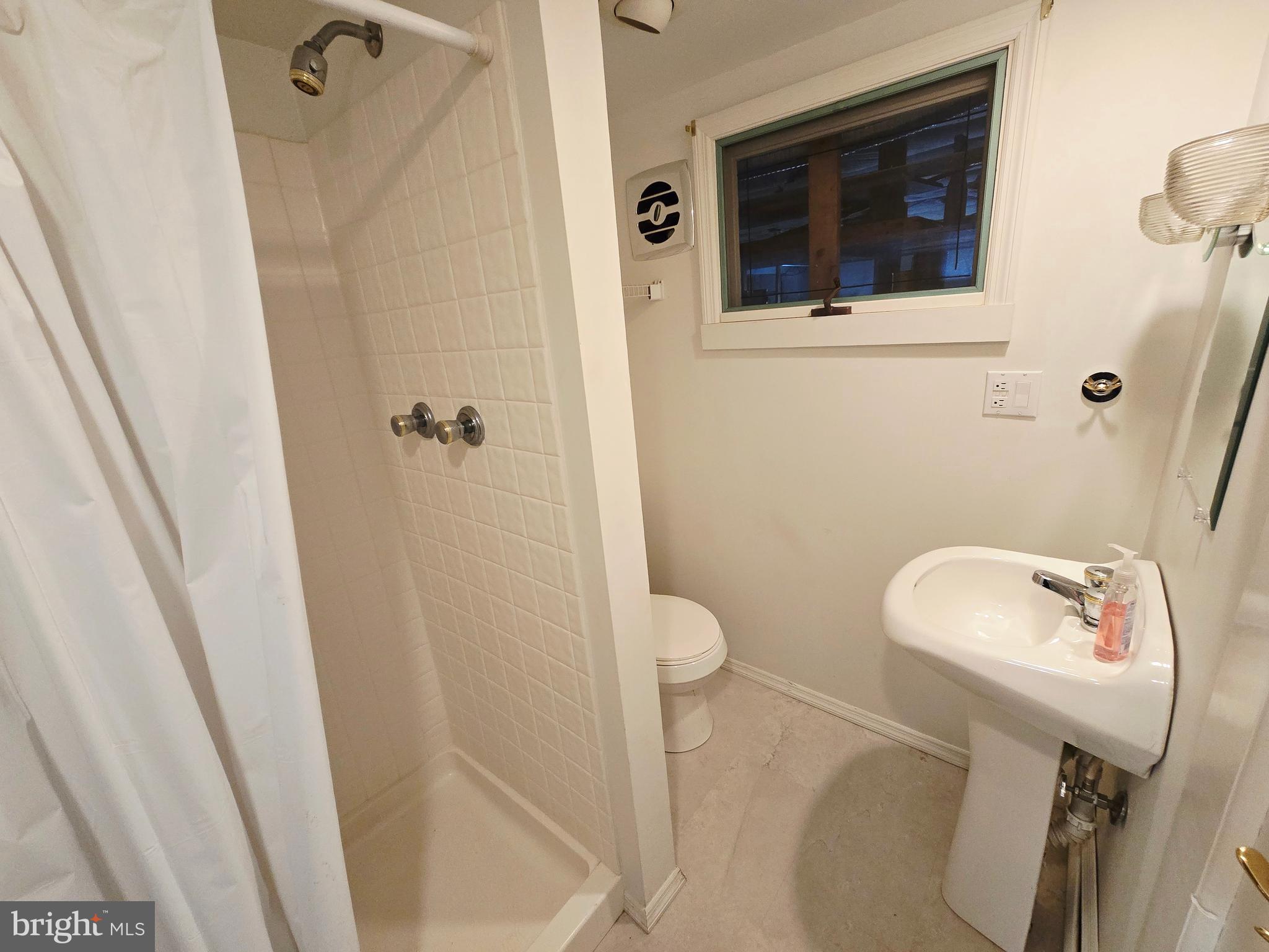 15421 Shamrock Road Southwest Cumberland, MD 21502 - Photo 31 of 39 a bathroom with a sink and toilet