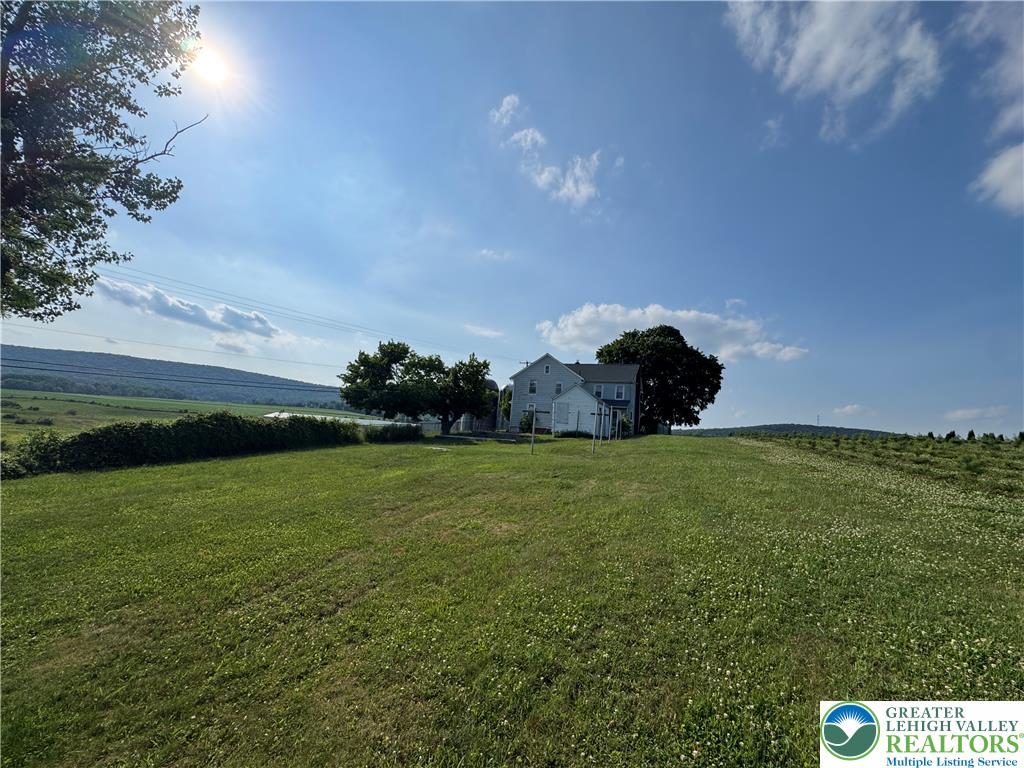 868 Catawissa Road Tamaqua, PA 18252 - Photo 8 of 67 Perched on a sun-drenched hill, this property offers verdant fields and a distant mountain vista.