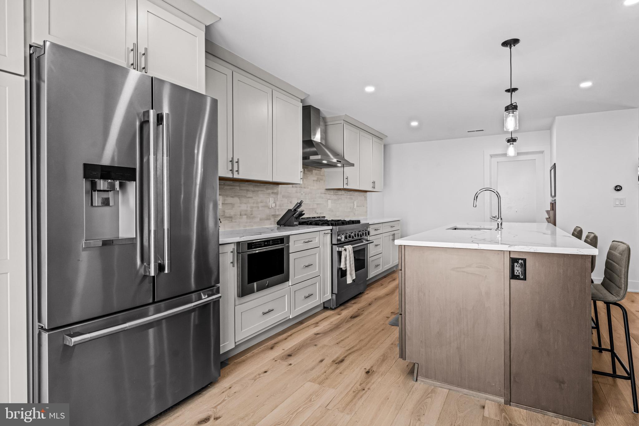 1828 Prospect Ridge Boulevard Haddon Heights, NJ 08035 - Photo 12 of 57 a kitchen with stainless steel appliances a refrigerator sink and stove