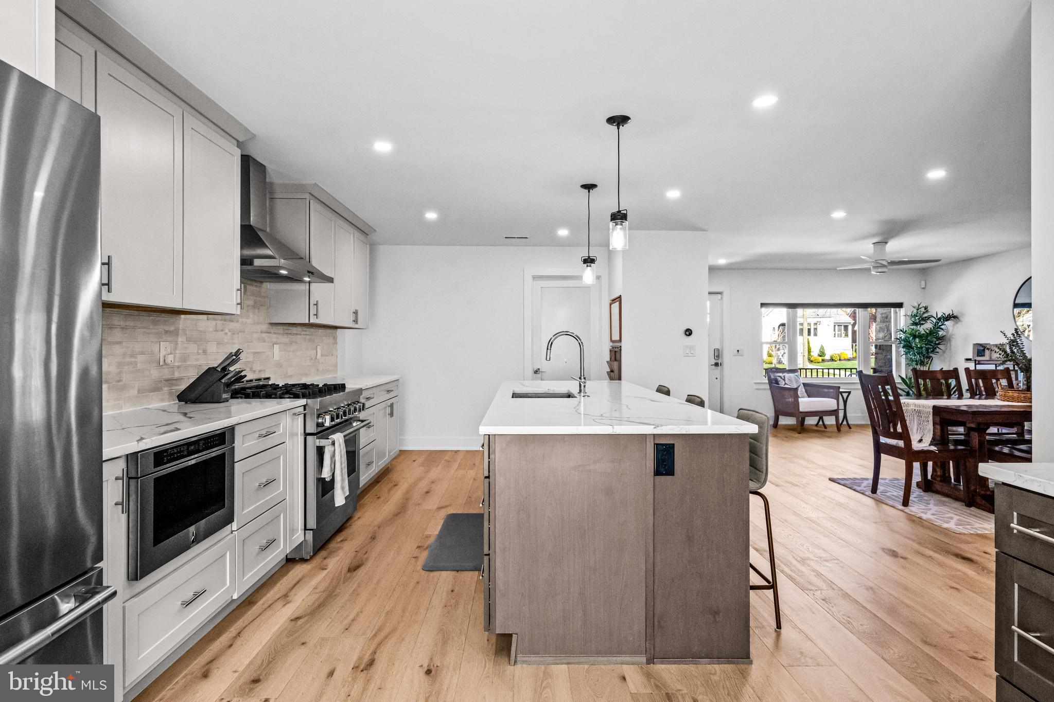 1828 Prospect Ridge Boulevard Haddon Heights, NJ 08035 - Photo 13 of 57 a large kitchen with stainless steel appliances lots of counter space and wooden floor