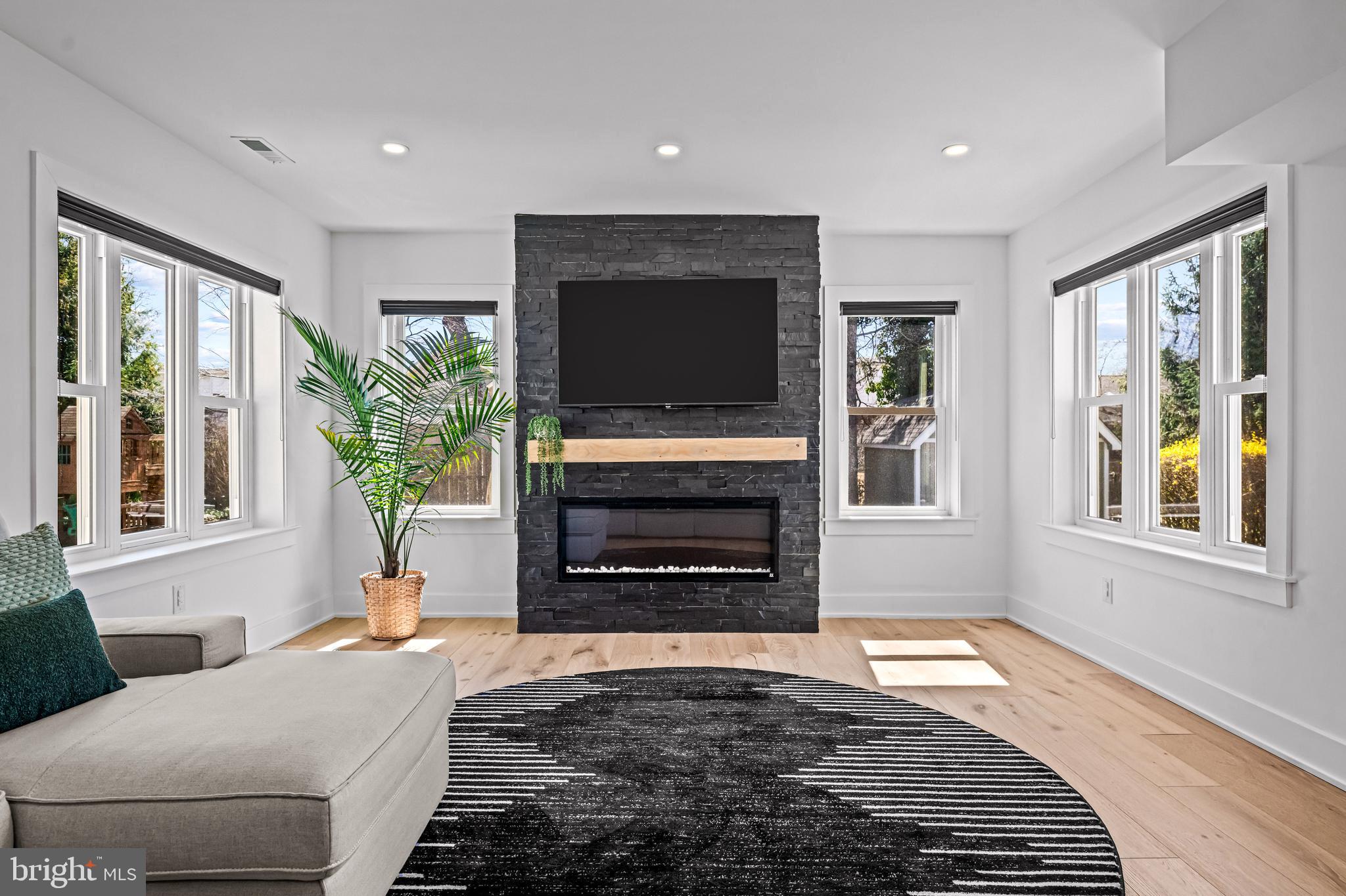 1828 Prospect Ridge Boulevard Haddon Heights, NJ 08035 - Photo 23 of 57 a living room with furniture a flat screen tv and a fireplace