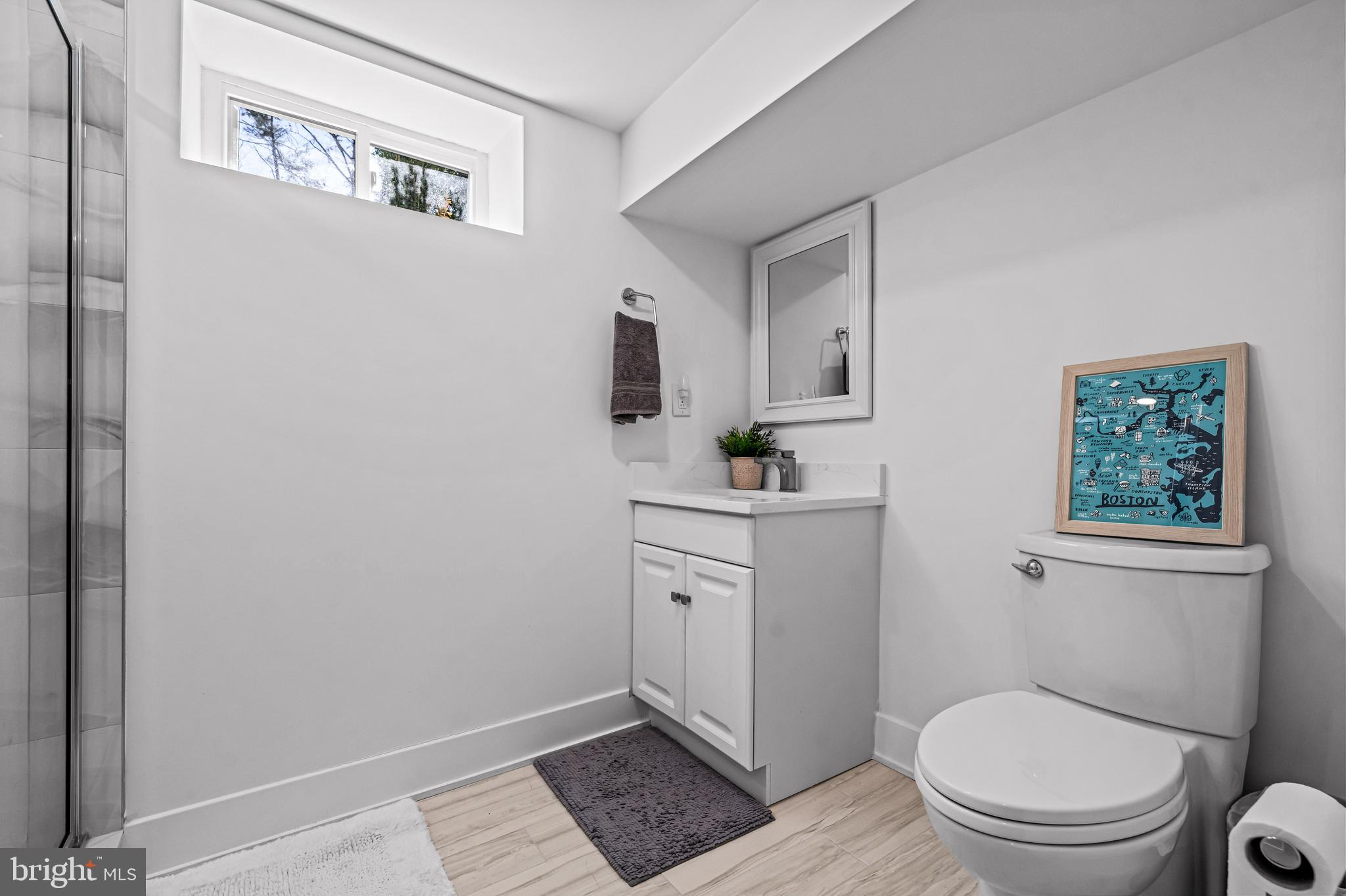 1828 Prospect Ridge Boulevard Haddon Heights, NJ 08035 - Photo 35 of 57 a bathroom with a toilet a sink and a window