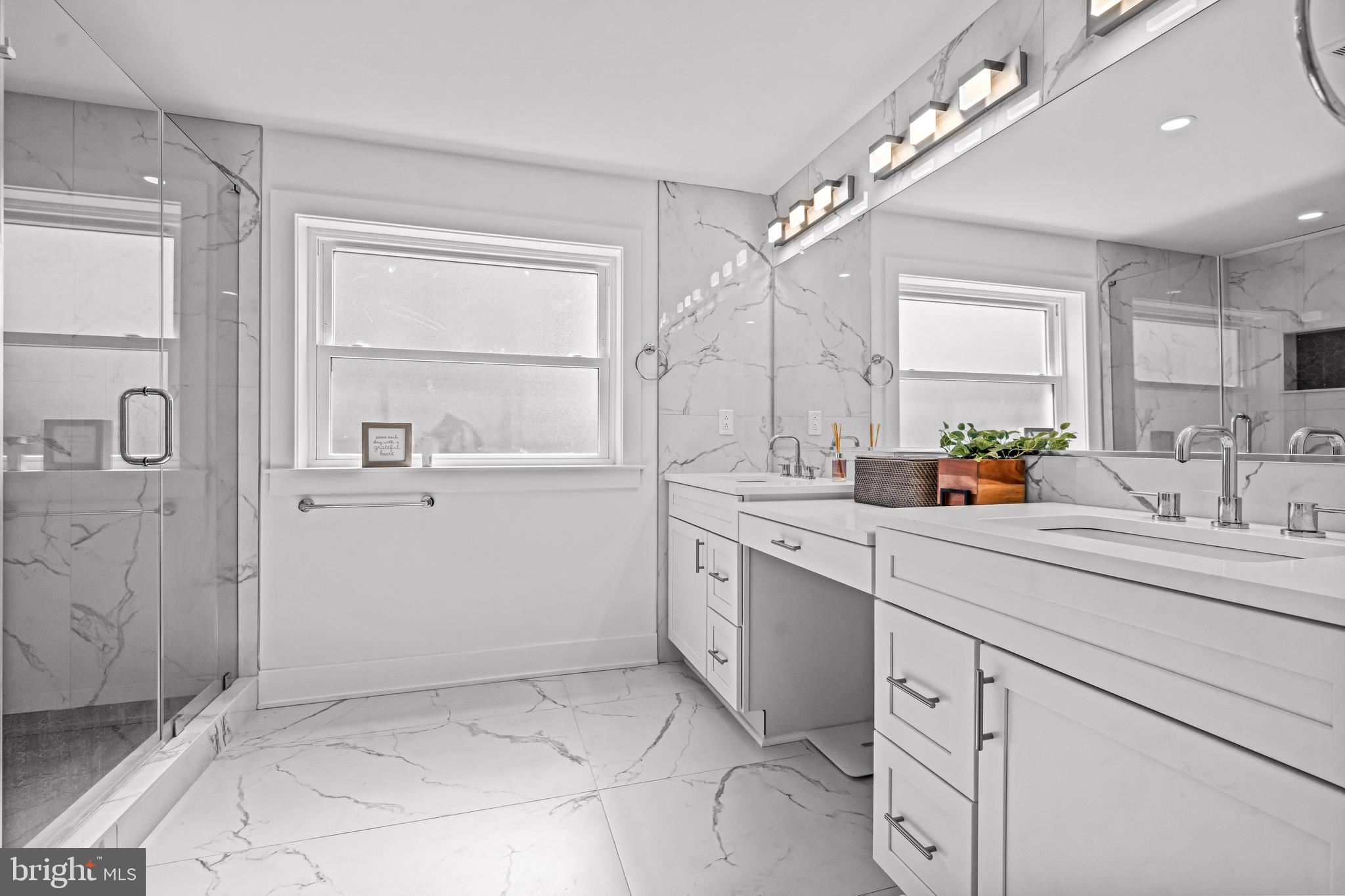 1828 Prospect Ridge Boulevard Haddon Heights, NJ 08035 - Photo 40 of 57 a spacious bathroom with a sink a mirror and a shower