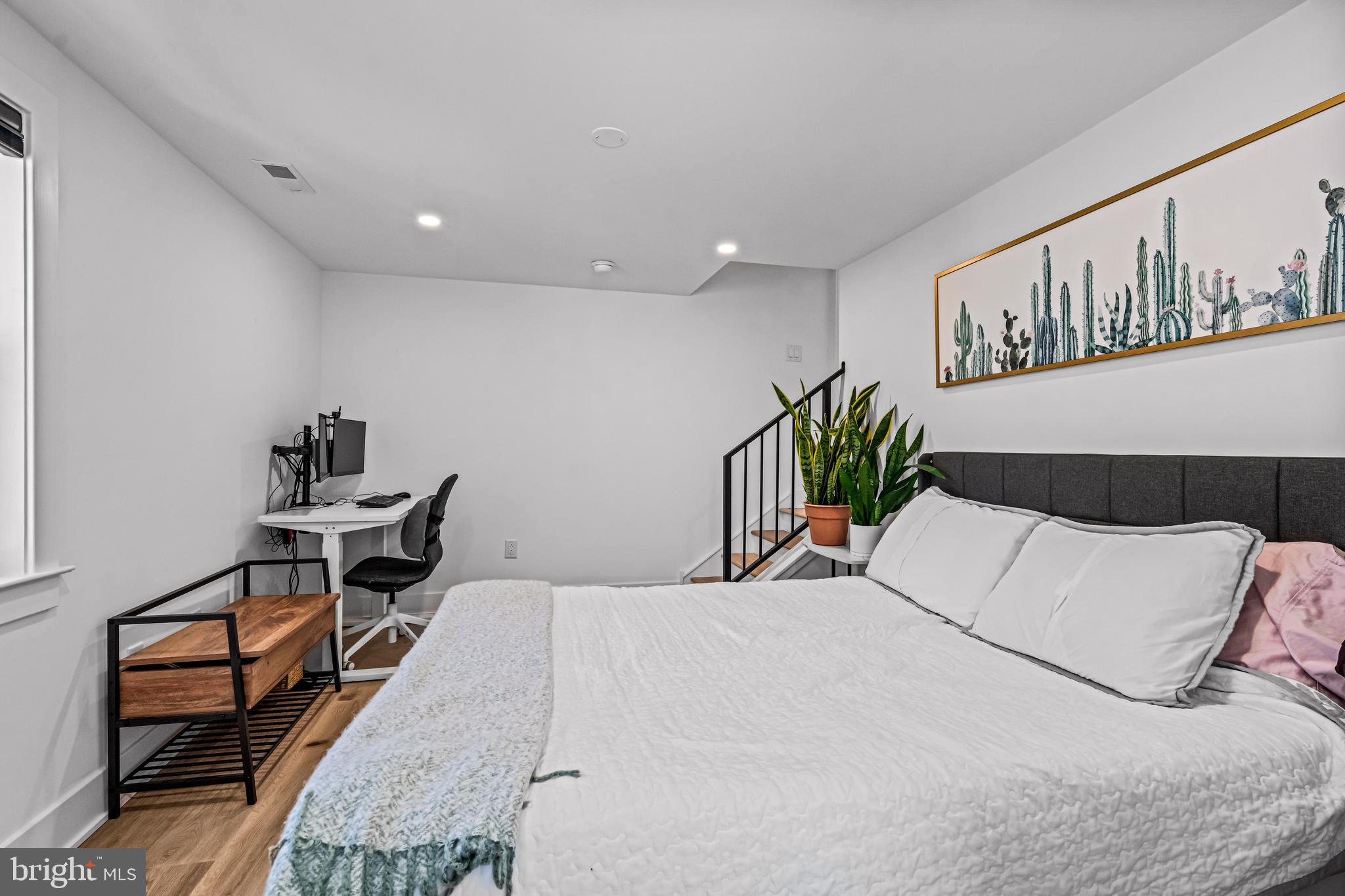 1828 Prospect Ridge Boulevard Haddon Heights, NJ 08035 - Photo 46 of 57 a bedroom with a bed a dresser and potted plant on the dresser