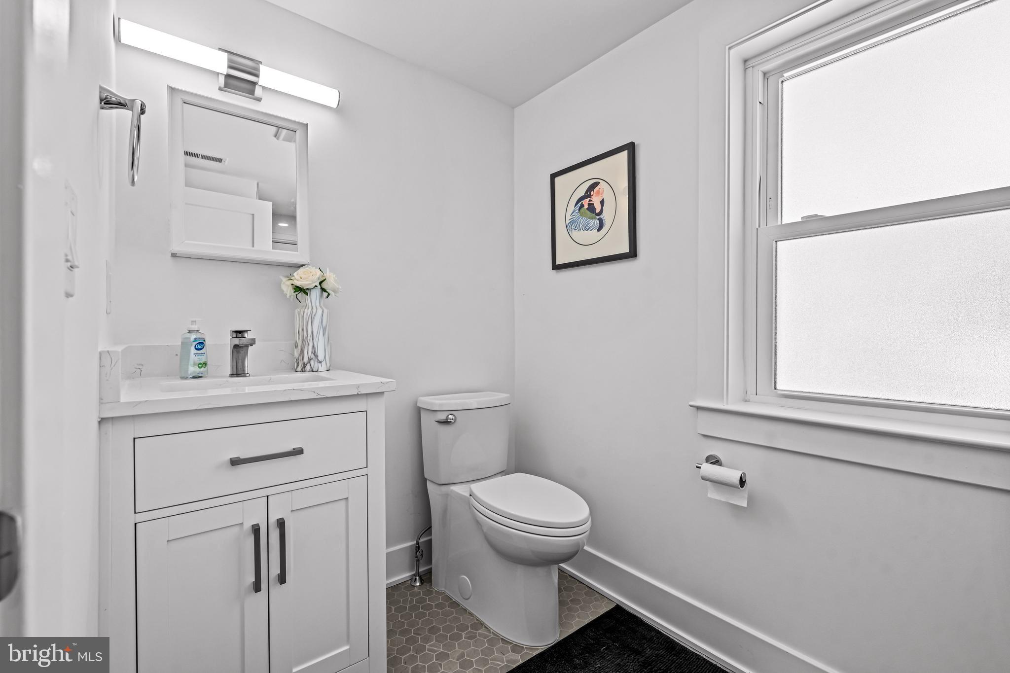 1828 Prospect Ridge Boulevard Haddon Heights, NJ 08035 - Photo 47 of 57 a bathroom with a toilet sink and mirror