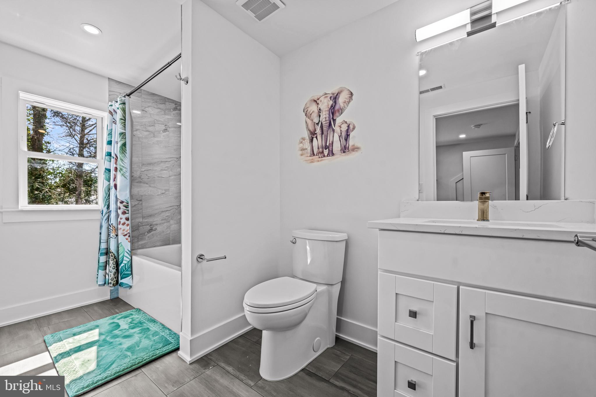 1828 Prospect Ridge Boulevard Haddon Heights, NJ 08035 - Photo 50 of 57 a bathroom with a toilet sink and mirror