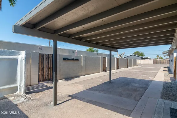 front view of a house with potted plants