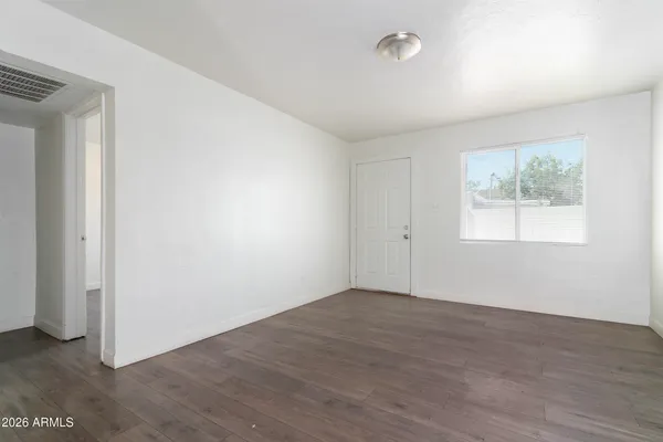 a view of a kitchen with a sink and a refrigerator