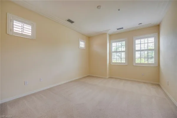 a bathroom with a granite countertop sink a large mirror a shower and a bathtub