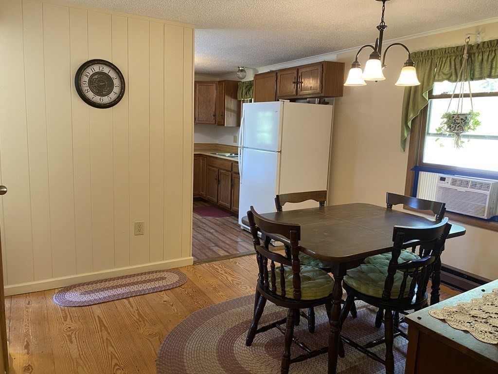 370 Nichols Road Barre, MA 01005 - Photo 10 of 25 a view of a dining room with furniture and window