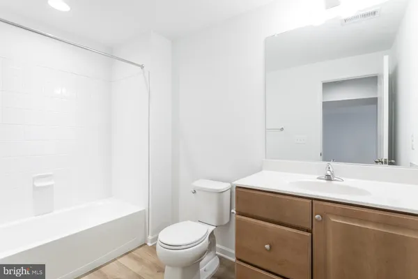 a bathroom with a sink a toilet and a bathtub