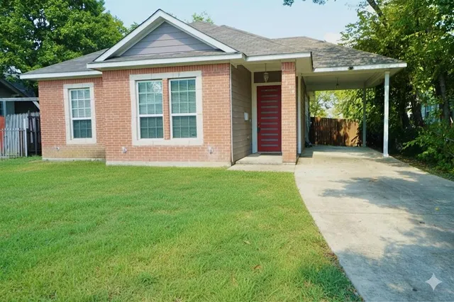 a front view of a house with a yard and porch