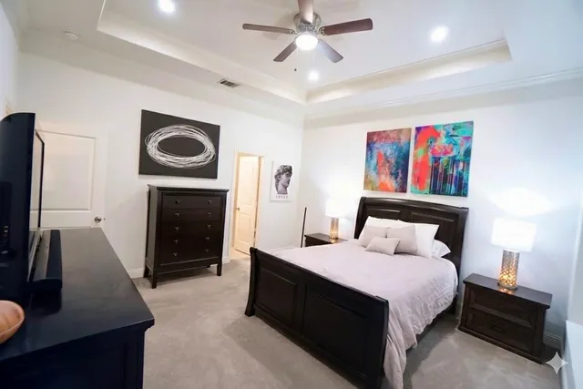 a bed room with a bed and a television