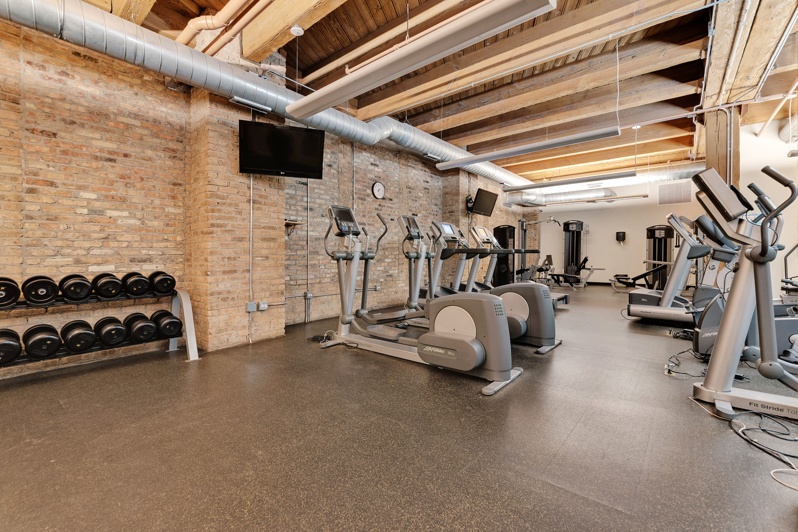 1040 West Adams Street, Unit 269 Chicago, IL 60607 - Photo 18 of 23 a view of a room with gym equipment