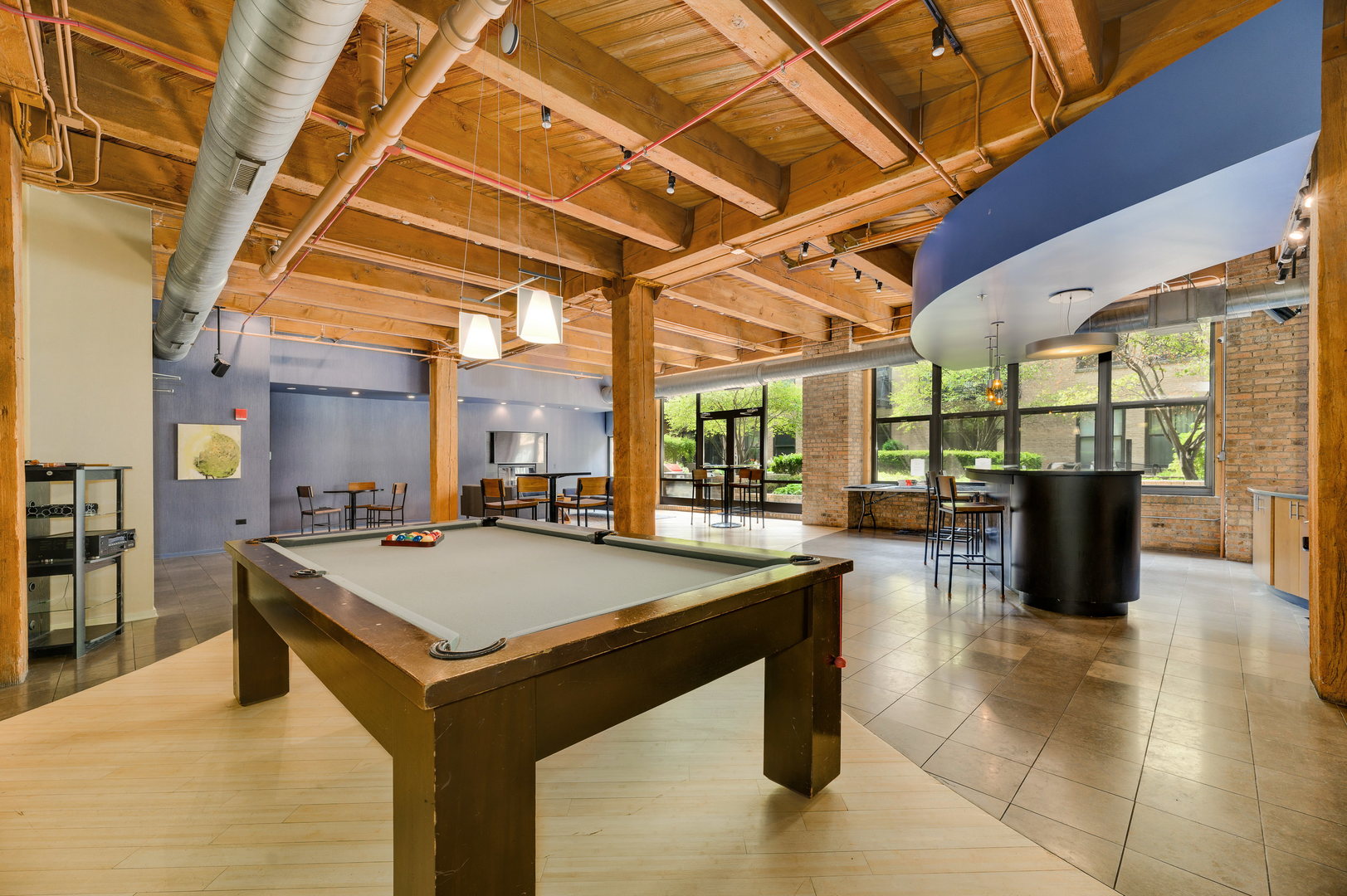 1040 West Adams Street, Unit 269 Chicago, IL 60607 - Photo 19 of 23 a room with pool table and chairs