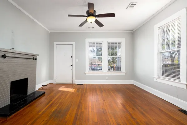 a view of room window and wooden floor