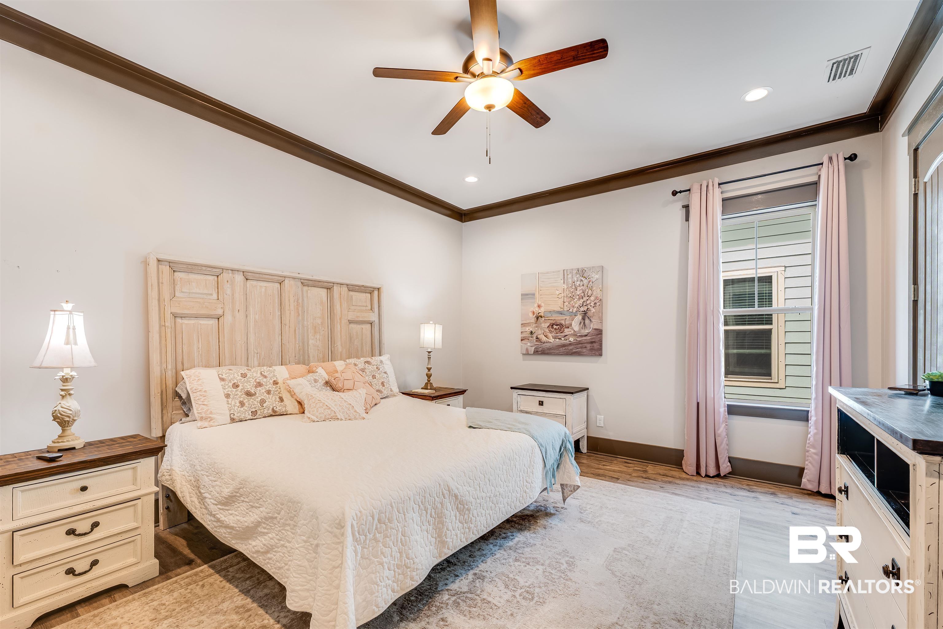 1119 Pink Poppy Lane Foley, AL 36535 - Photo 11 of 38 Primary bedroom on main floor featuring crown molding, light wood-type flooring, recessed lighting, and ceiling fan