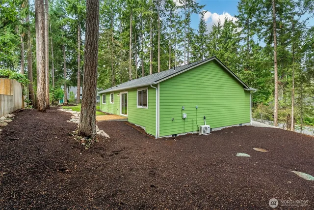 a view of a house with a backyard