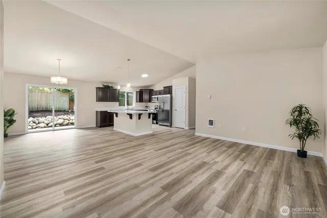 a view of kitchen with furniture and wooden floor