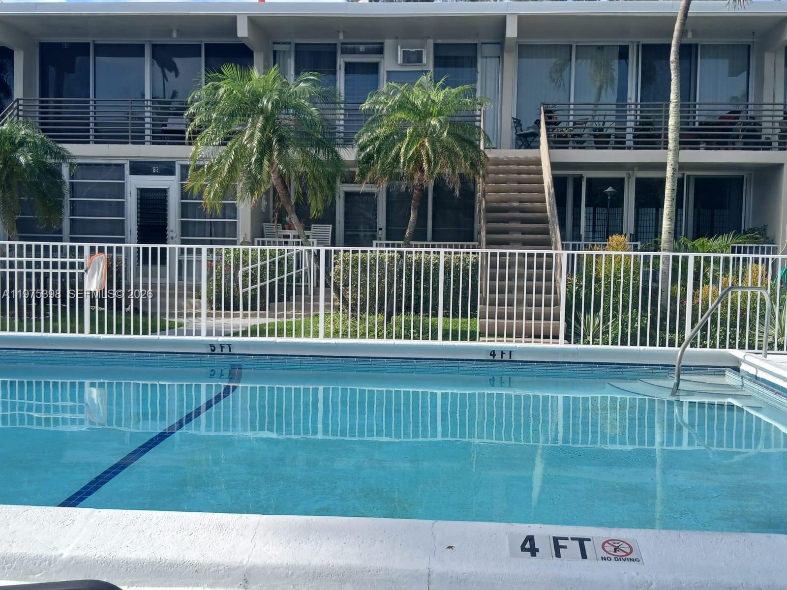 901 North Birch Road, Unit 9B Fort Lauderdale, FL 33304 - Photo 6 of 12 a view of a house with a yard