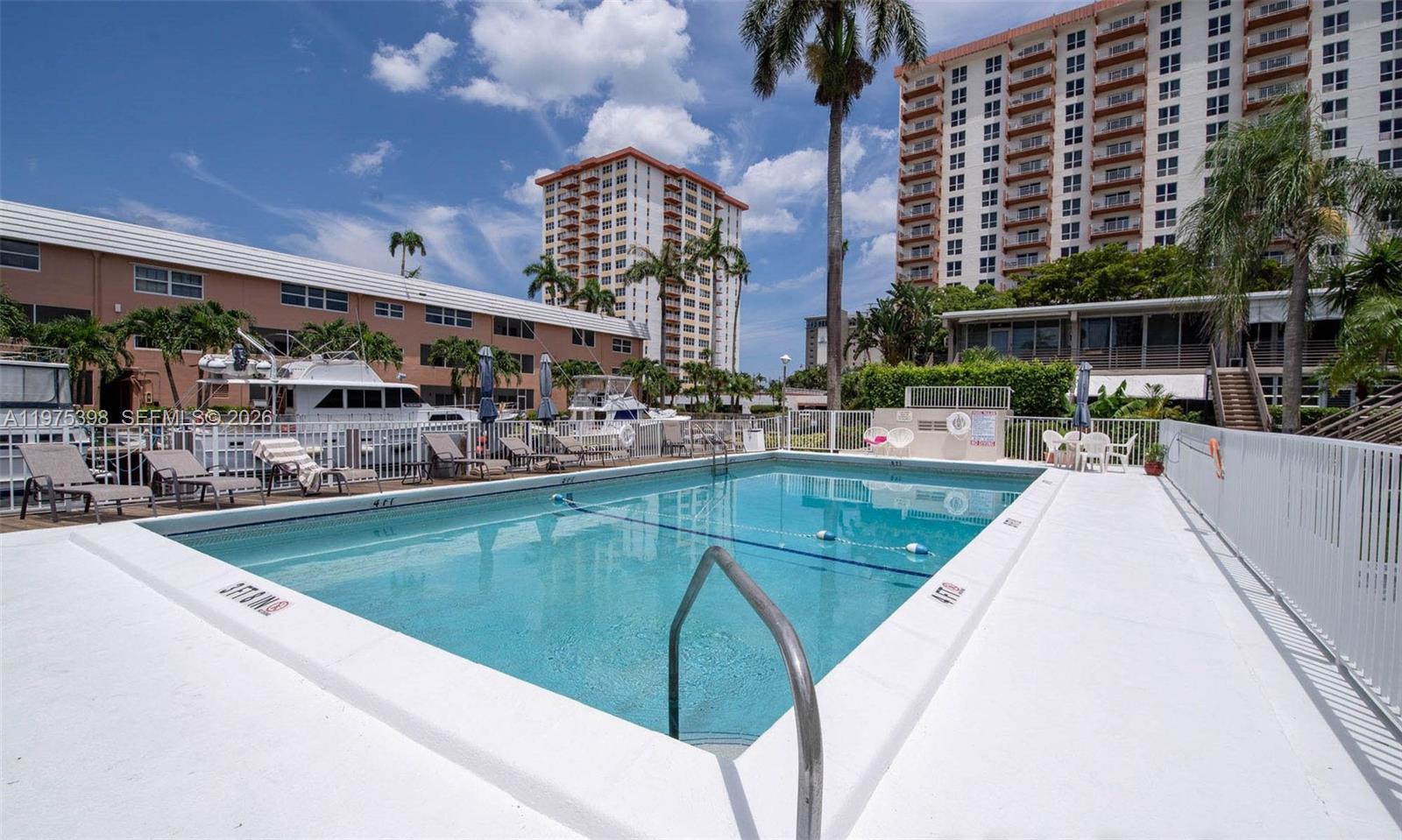 901 North Birch Road, Unit 9B Fort Lauderdale, FL 33304 - Photo 7 of 12 a view of a swimming pool with outdoor seating