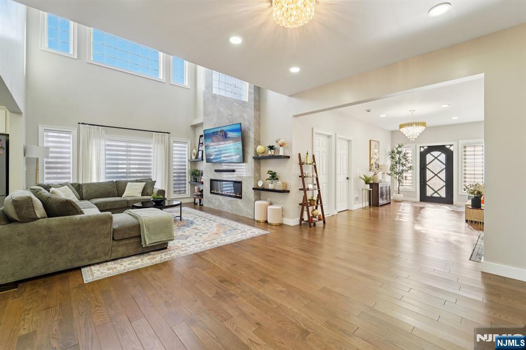 24 Holmes Lane Wayne, NJ 07470 - Photo 15 of 47 a living room with furniture and a wooden floor