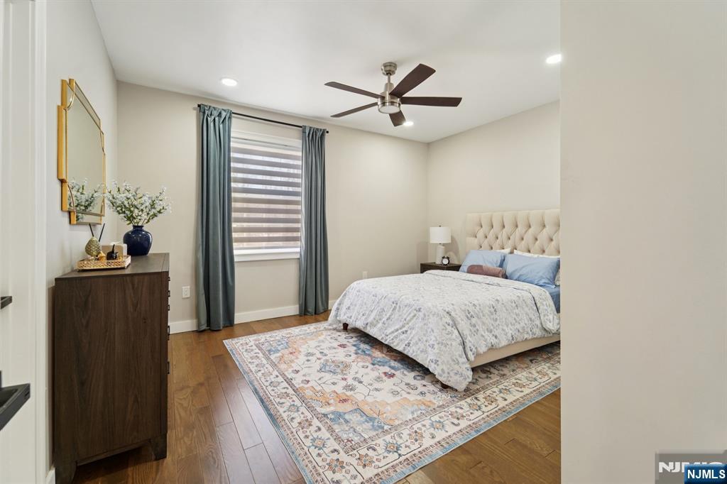 24 Holmes Lane Wayne, NJ 07470 - Photo 19 of 47 a bedroom with a bed and a dresser