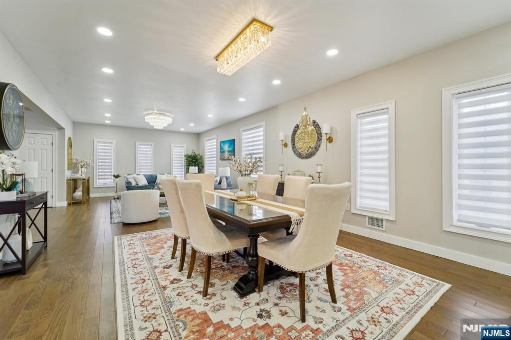 24 Holmes Lane Wayne, NJ 07470 - Photo 9 of 47 a view of a dining room with furniture and wooden floor