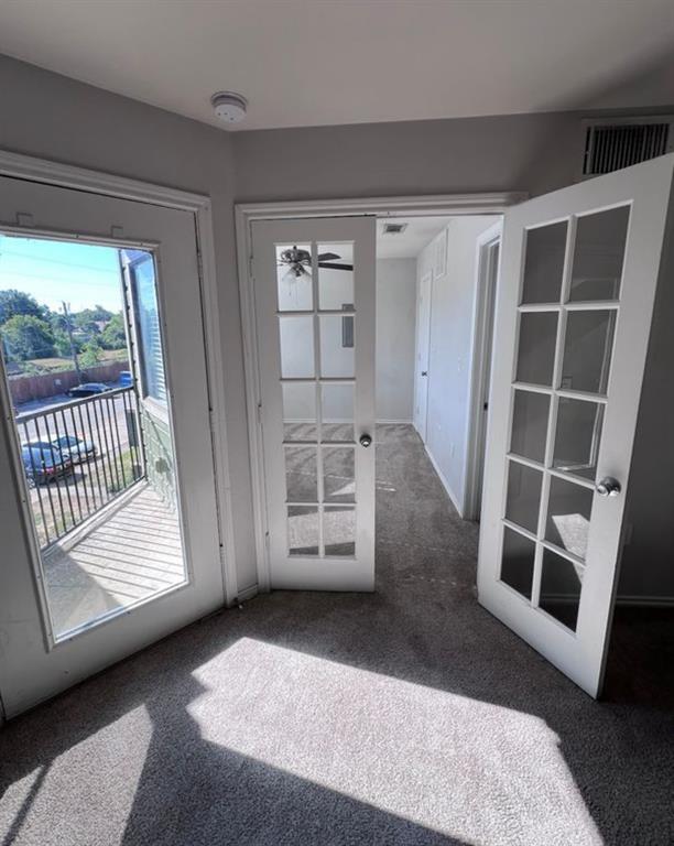 9837 Walnut Street, Unit 305 Dallas, TX 75243 - Photo 6 of 10 a view of an empty room with a window